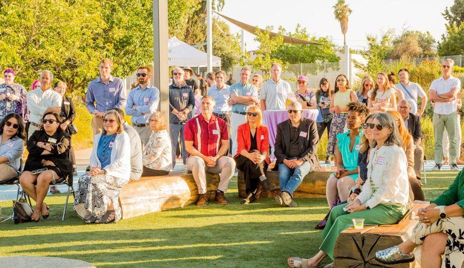 Guadalupe River Park Conservancy supporters gathered on the lawn at a park event